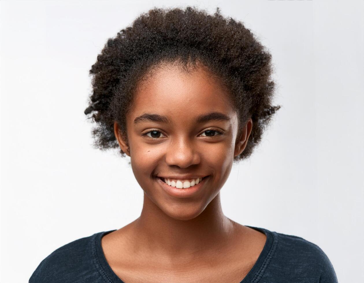 Close Up Portrait of African Teenager with Defined Defined Shaved Curls on White Background photo