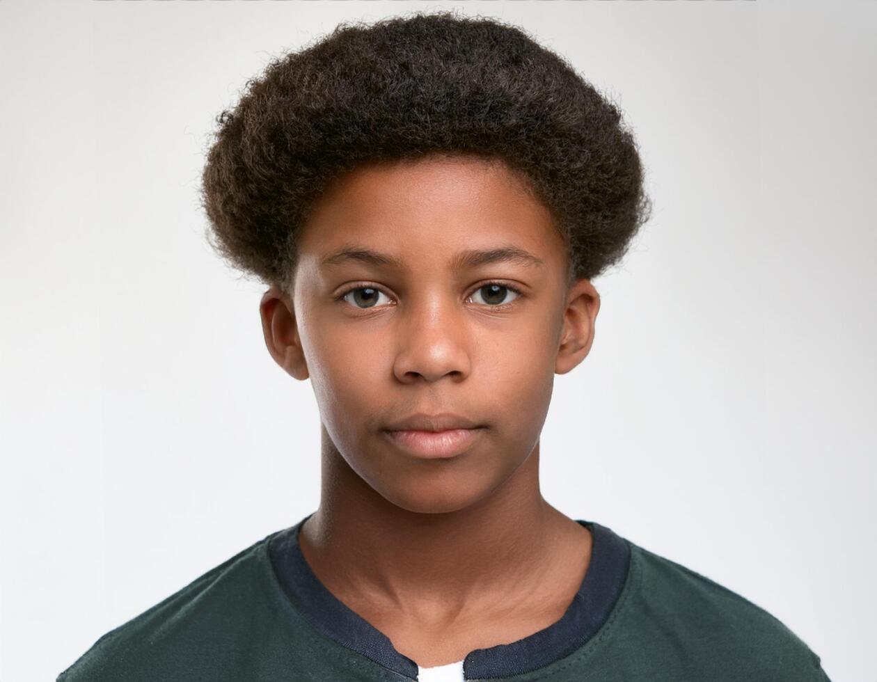 Portrait of African Teenager with Defined Defined Medium Length Natural Curls on White Background photo