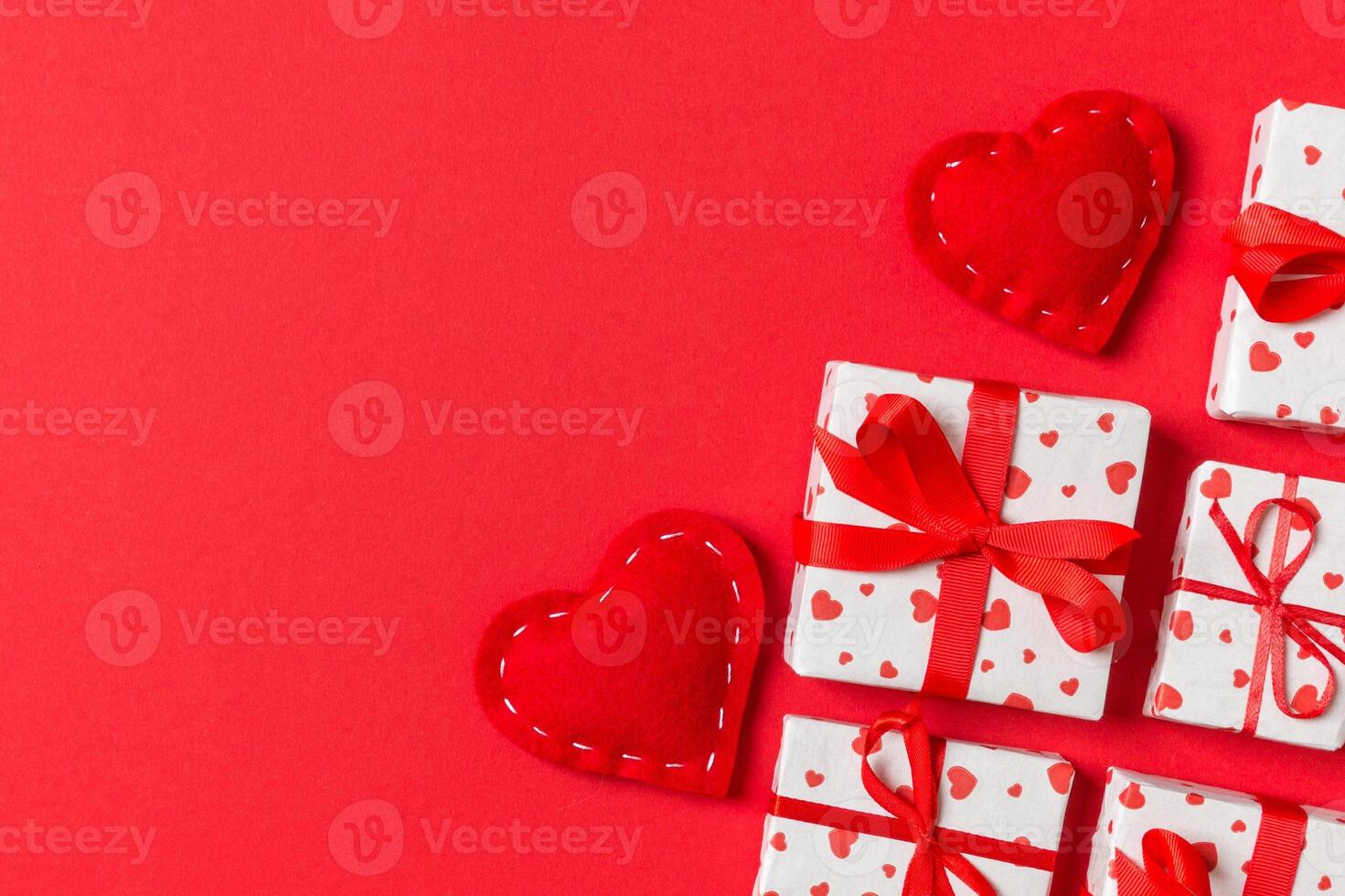 Holiday composition red textile hearts on colorful background with empty space for your design. Top view of Valentine's Day concept photo