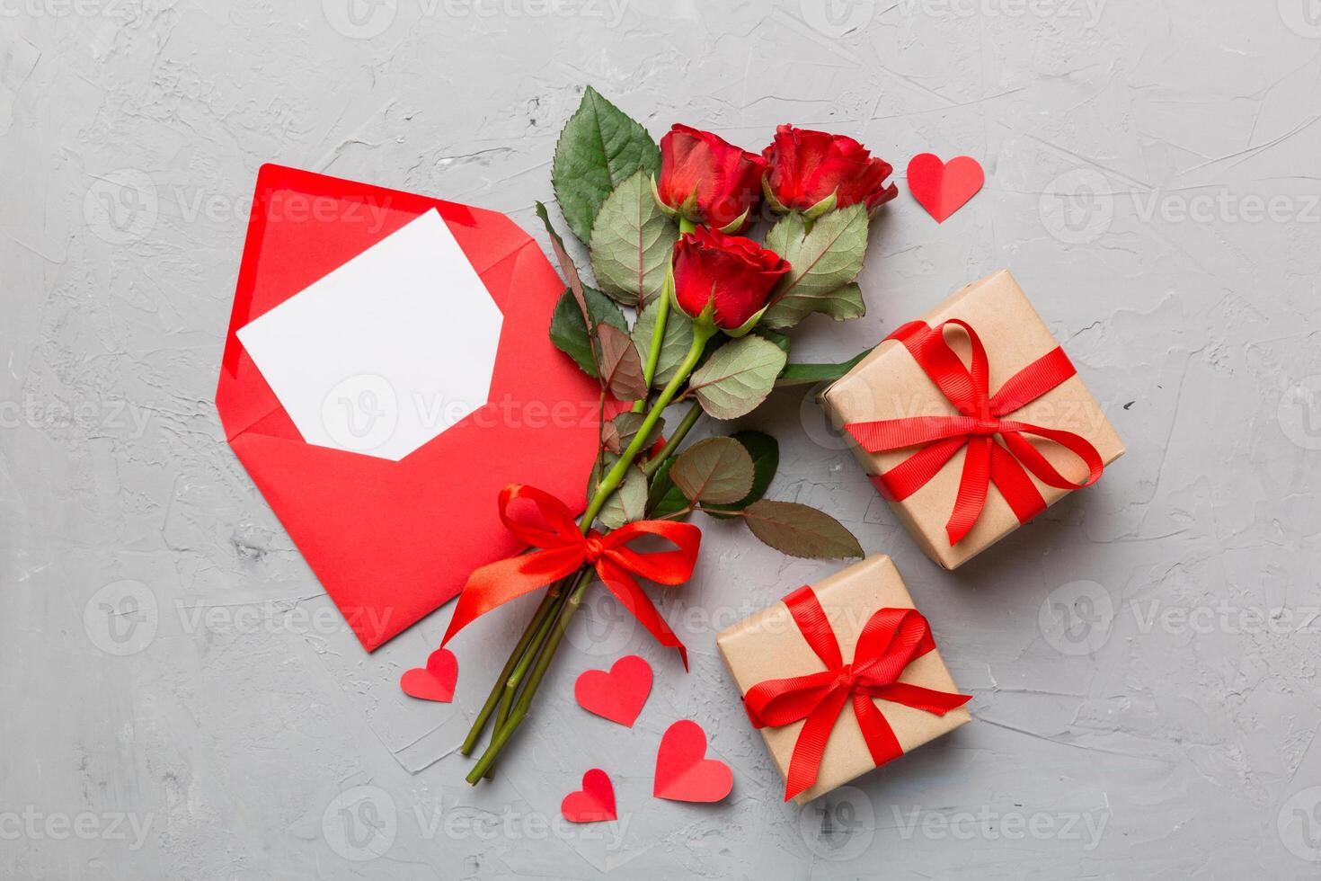 Valentine day composition with Envelope, rose flower and heart on table. Top view, flat lay. Holiday concept photo