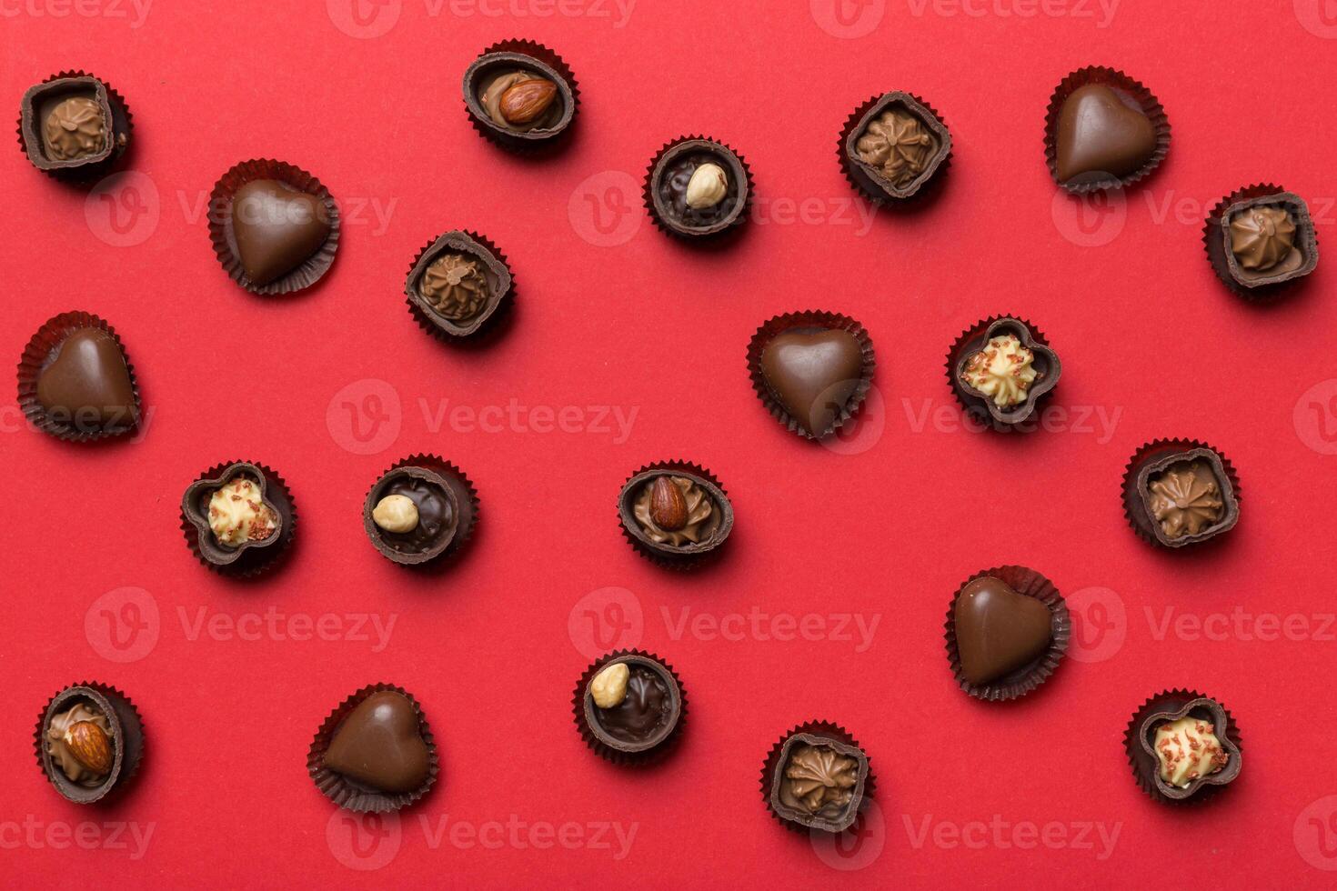 Different kinds of chocolates colored table close-up. Top Flat Lay photo