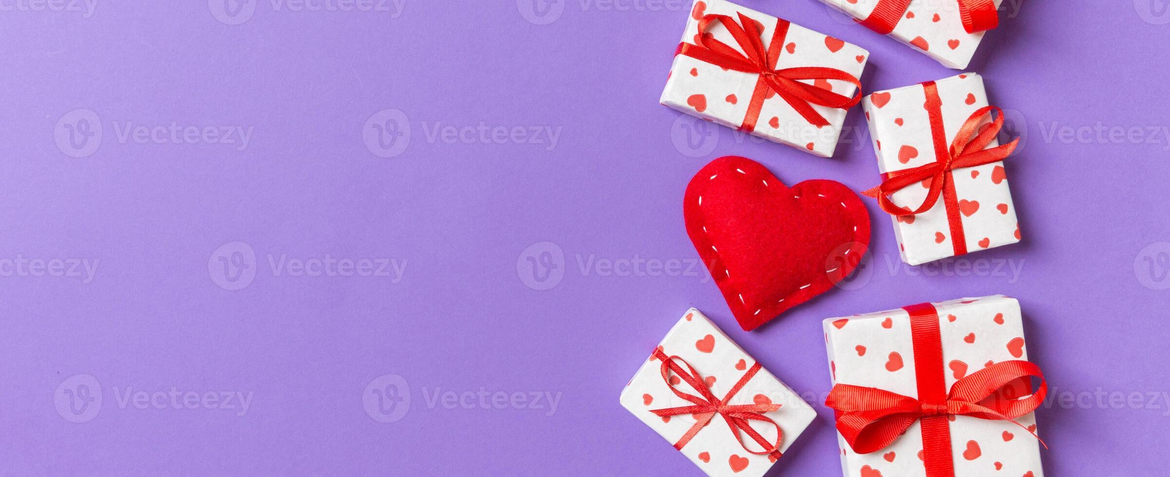 Top view of gift boxes and red textile hearts. St Valentine's day concept with copy space photo