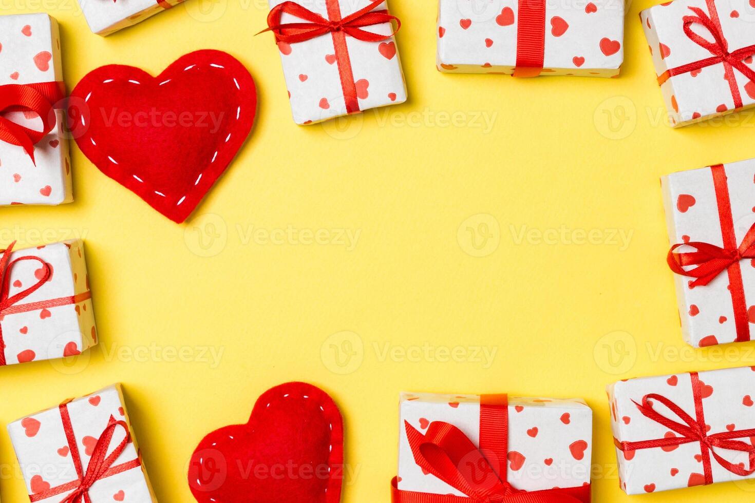 Top view of festive gift boxes and red textile hearts photo