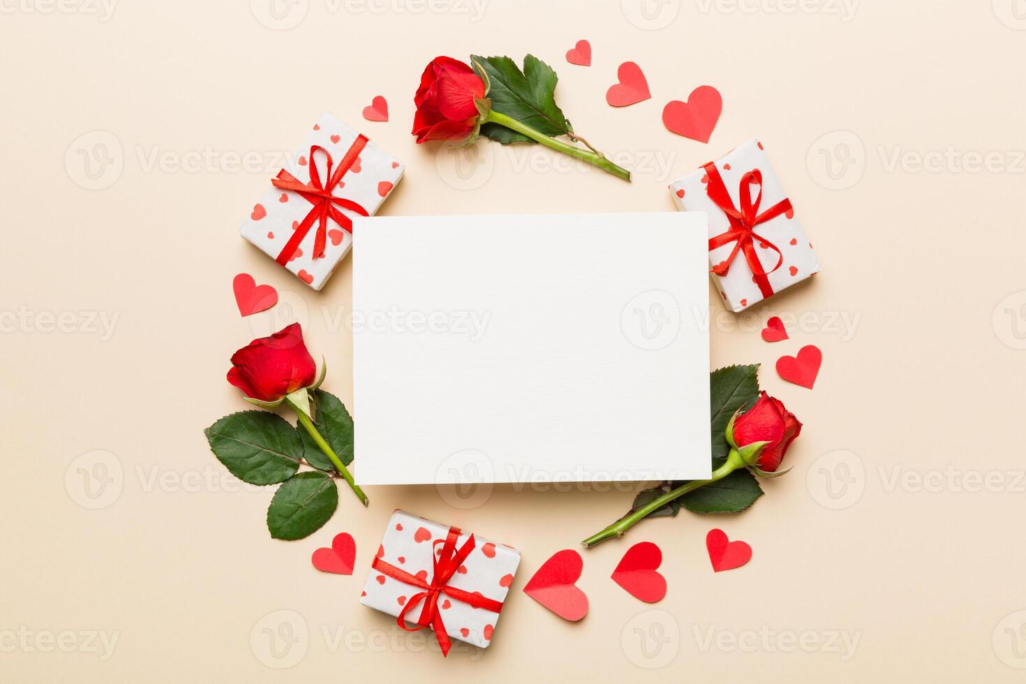 Frame made of rose, git box, heart and blank greeting card on Colored background. Top view, flat lay, copy space Holiday, Mothers Day, birthday concept photo
