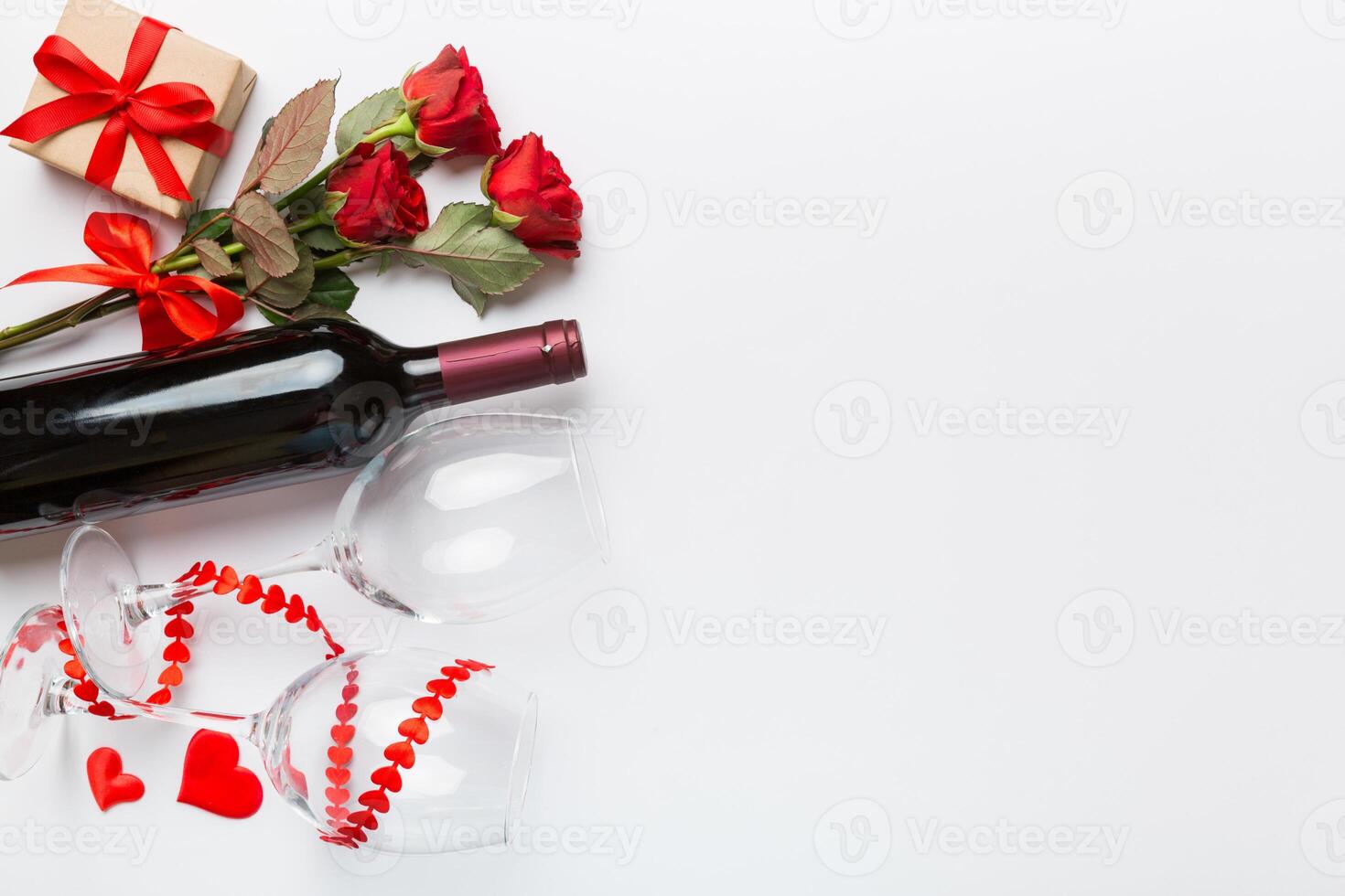 Valentine's day composition with red wine gift box on table. Top view, flat lay. Holiday concept photo