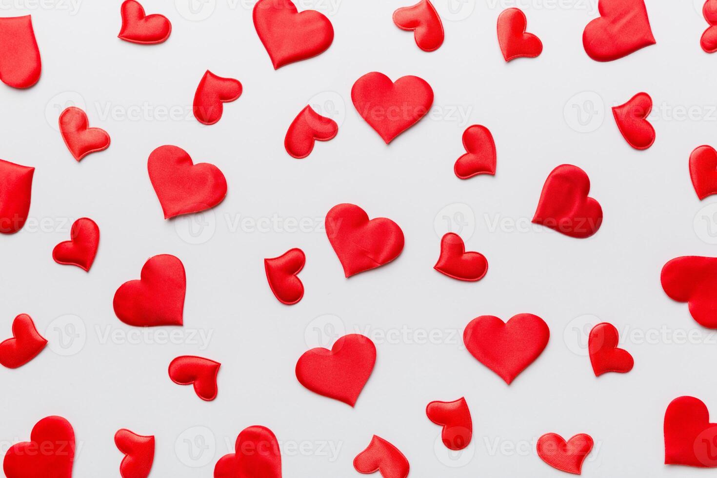 Valentine day background with red hearts top view photo