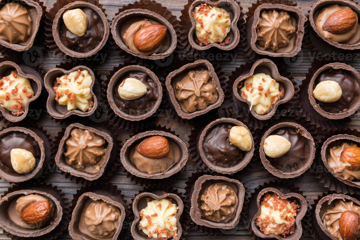 Different kinds of chocolates on colored table close-up. and Flat Lay photo