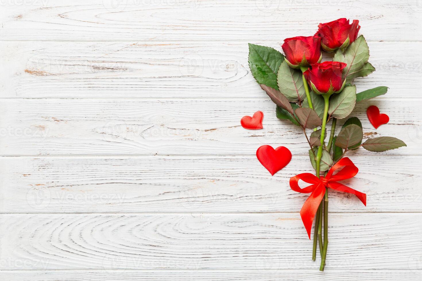 Valentine day composition with rose flower and red heart table. Top view, flat lay, copy space Holiday concept photo