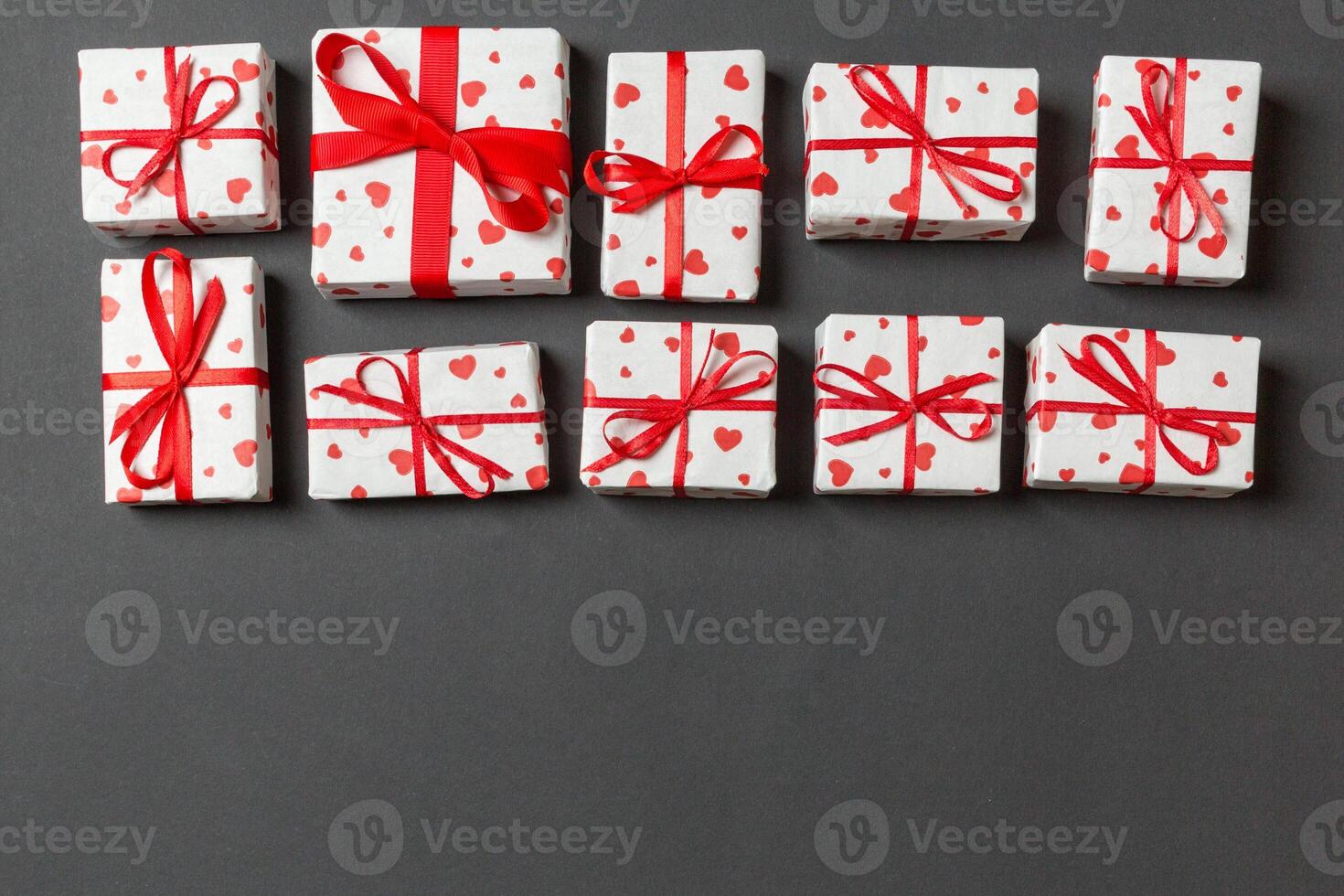 Top view of gift boxes with red hearts colorful background. St Valentine's day concept with copy space photo