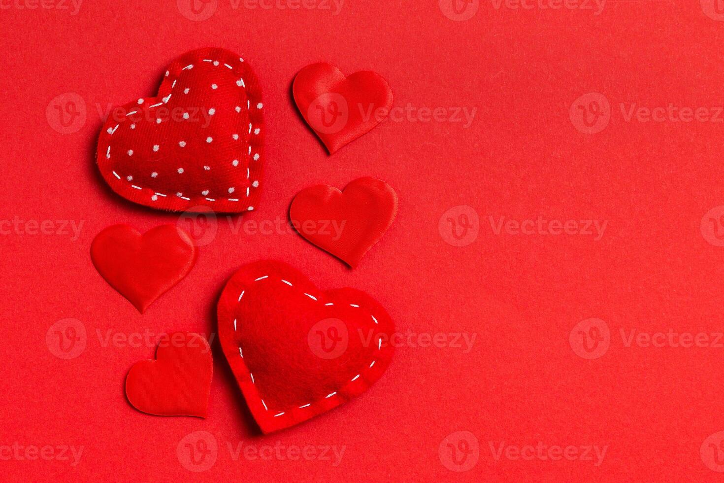 Top view composition red hearts on colorful background. Romantic relationship concept. Valentaine's Day photo