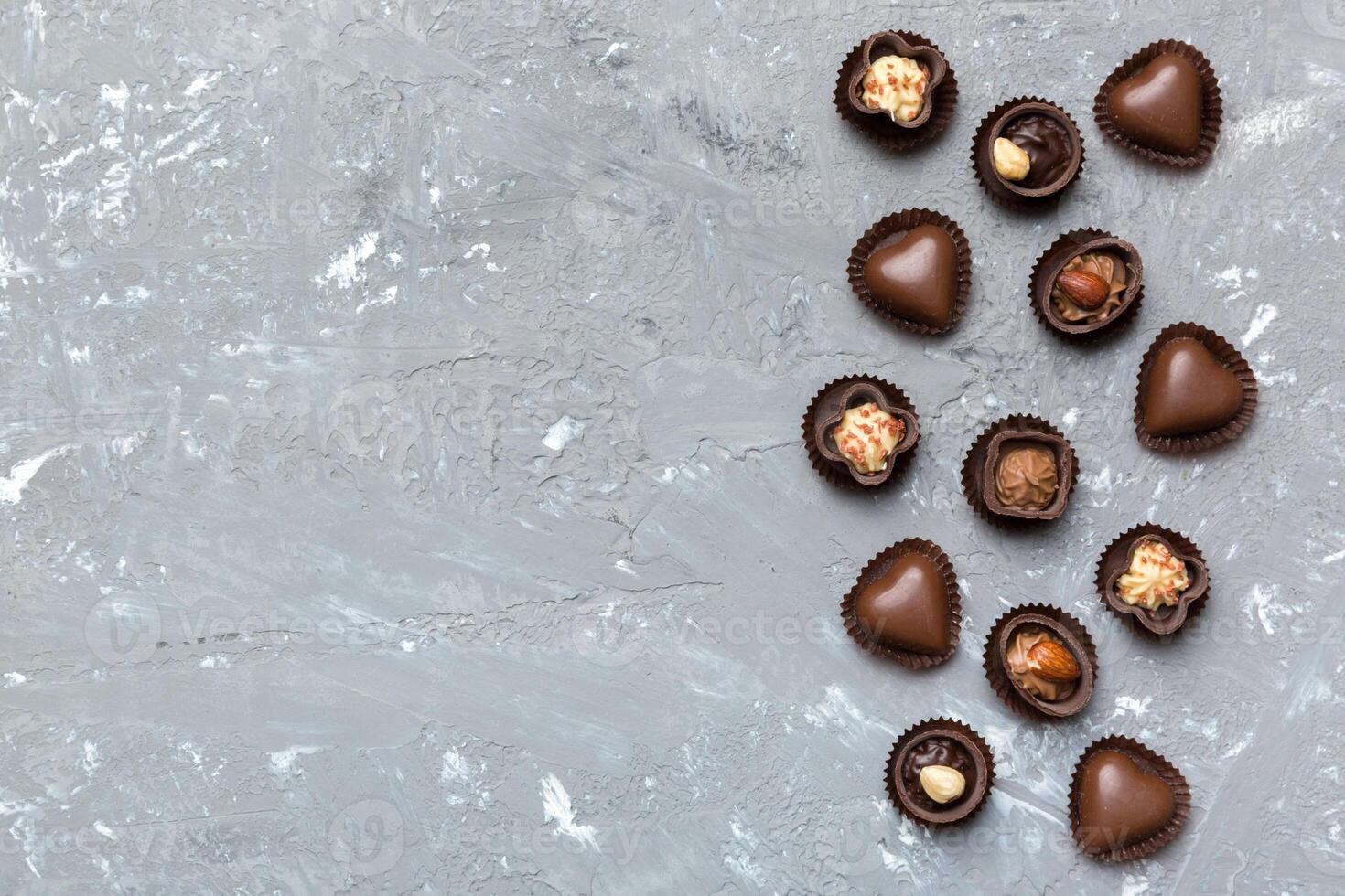 Different of chocolates on colored table close-up. Top View and Flat Lay with copy space photo