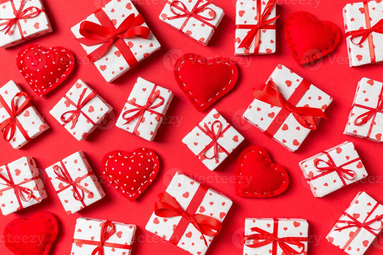 Top view of white gift boxes and red textile hearts photo