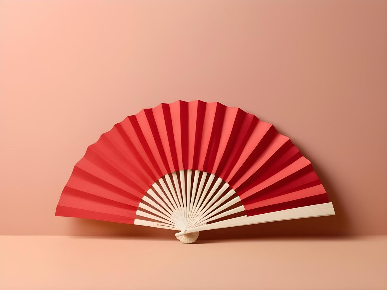 A refined red paper fan set against a soft, neutral cream backdrop, leaving plenty of room for text or a logo. photo