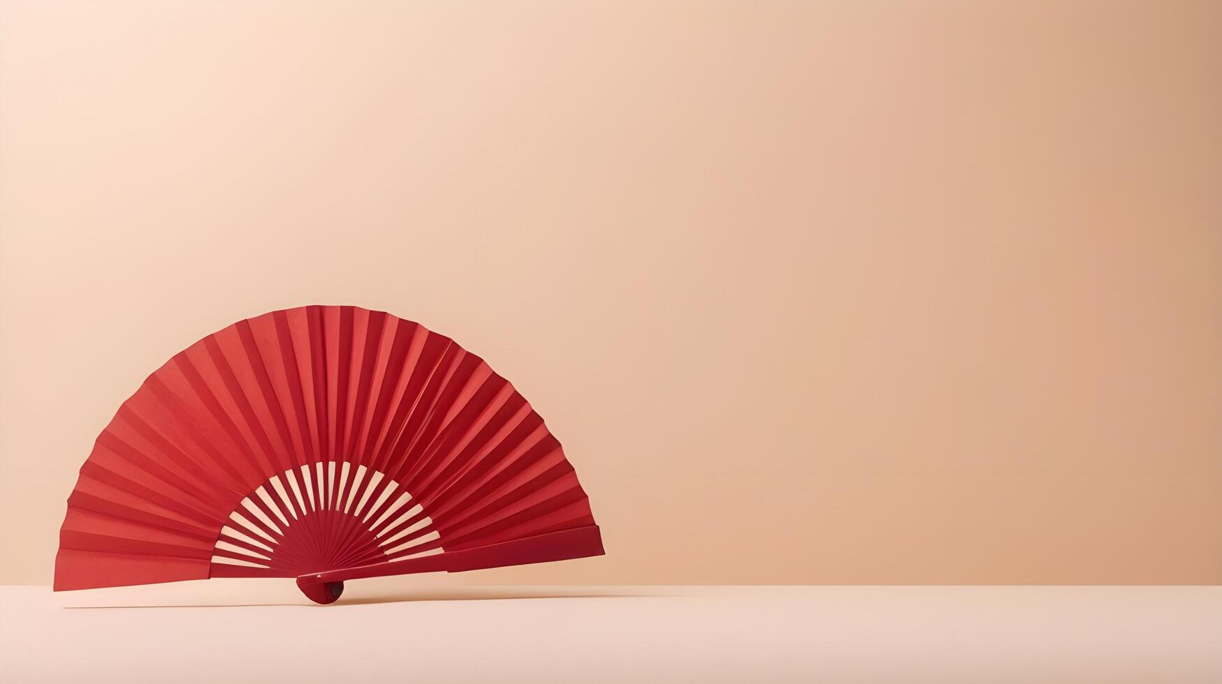 A simple red paper fan positioned against a soft cream background, with minimal detail and space for a brand logo or text. photo