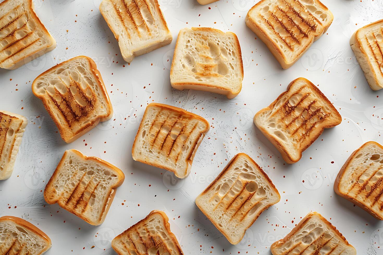 Slices of toasted bread on white background photo