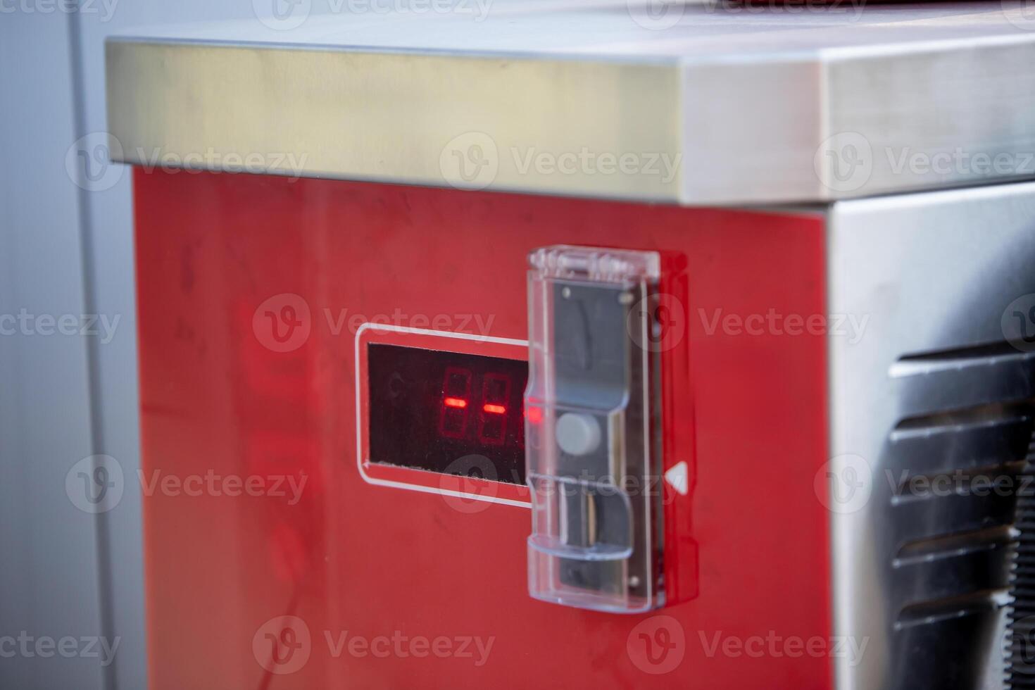 Red Industrial Appliance with Digital Display and Metallic Top photo