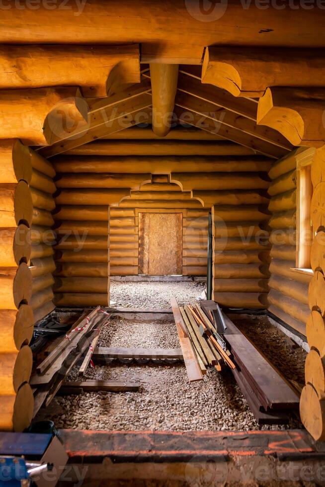 Interior of Partially Constructed Log Cabin with Wooden Log Walls photo