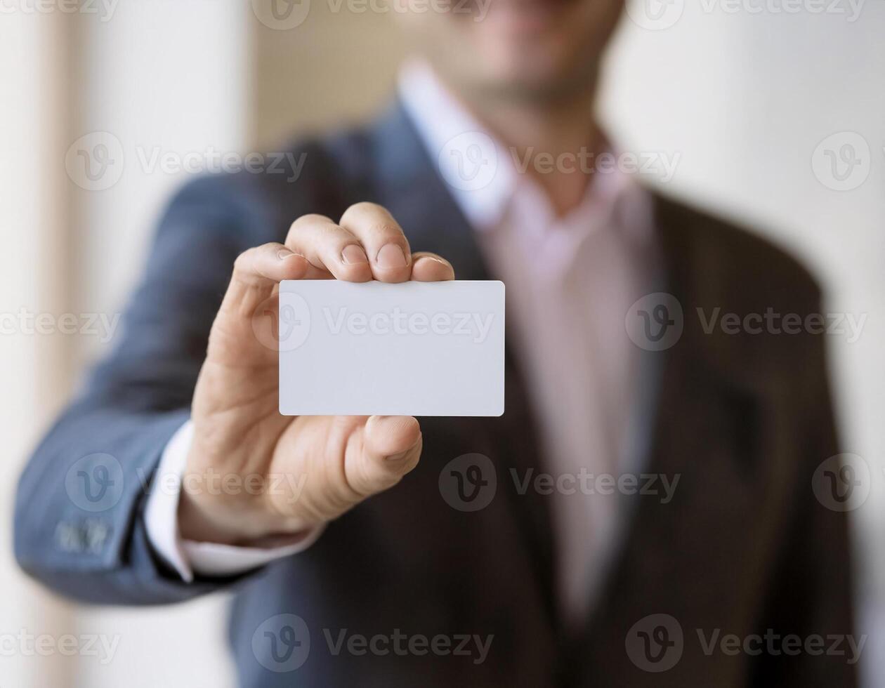 Business Introduction. Close-Up of Male Employee Offering White Business Card photo