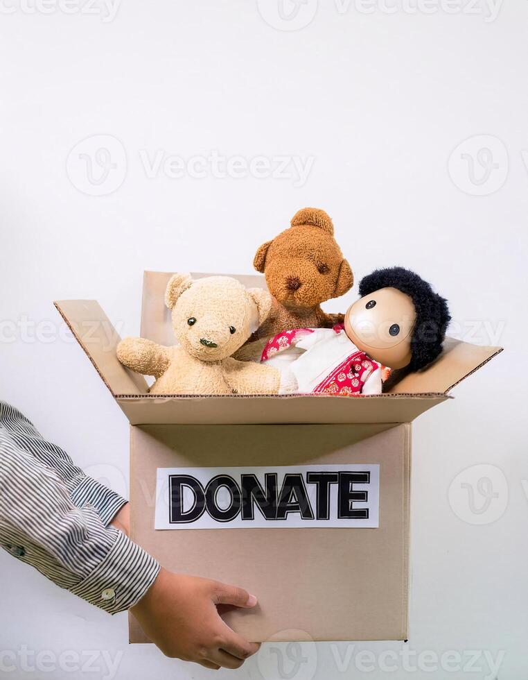 Hands of Hope, Open Box Marked 'Donate' Filled with a Toy Doll photo