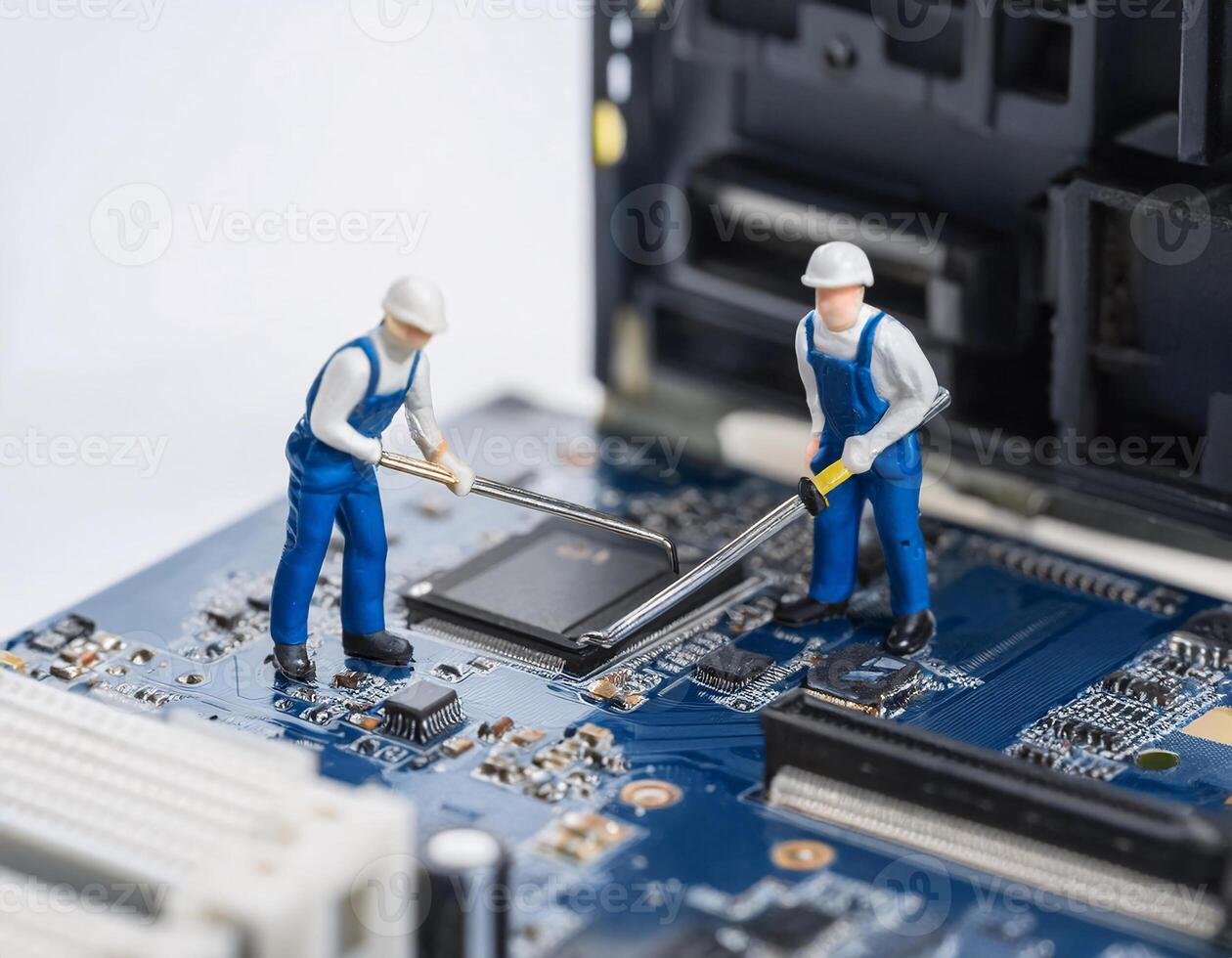 Miniature Technicians Toy Workers Repairing a Computer Keyboard photo
