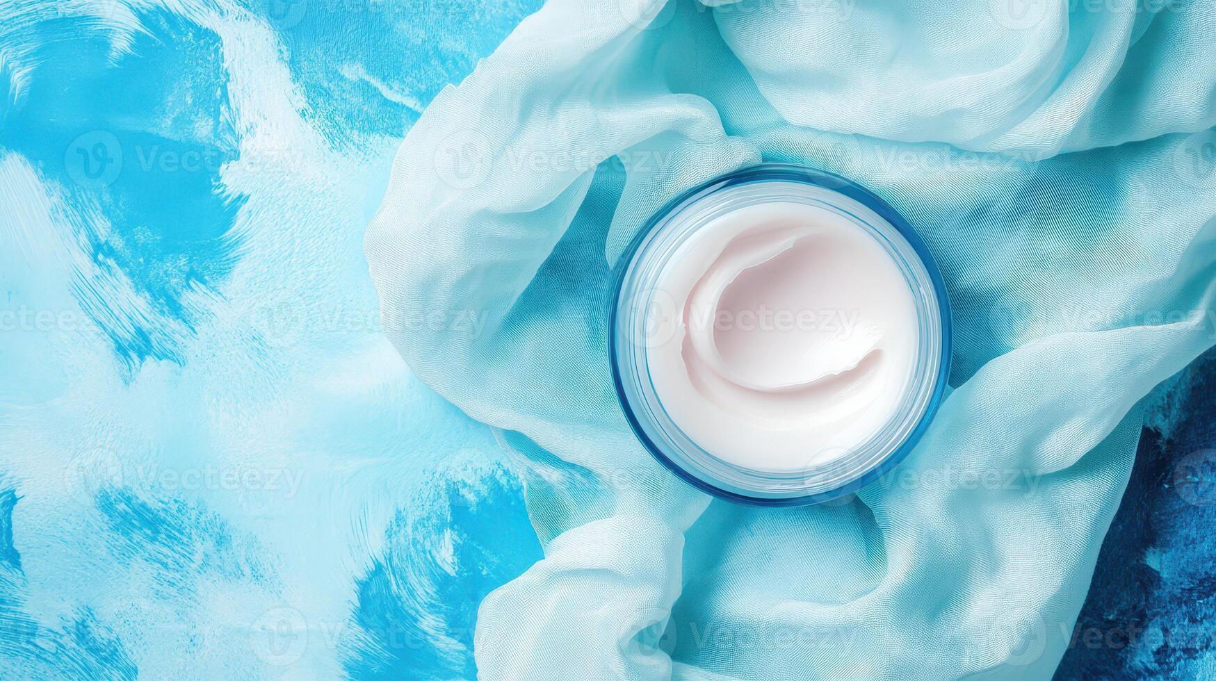 A jar of cream on a blue background photo
