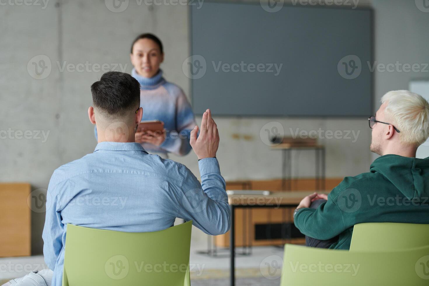 A diverse multiethnic business team engages in a collaborative meeting, discussing strategies and solutions in a modern office setting photo