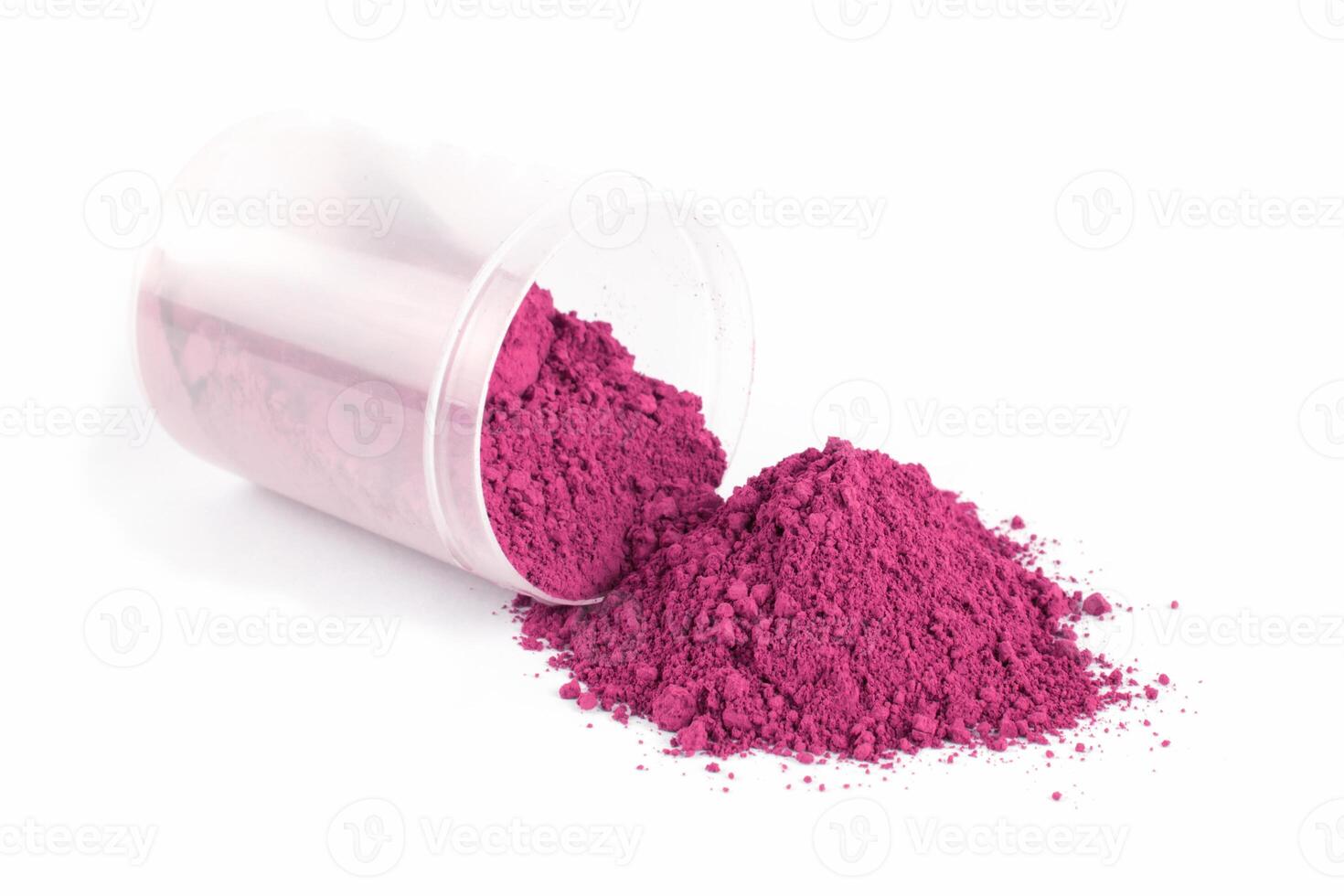 Bright Pink Powder Spills From Glass Container on White Background During Art Project Preparation photo