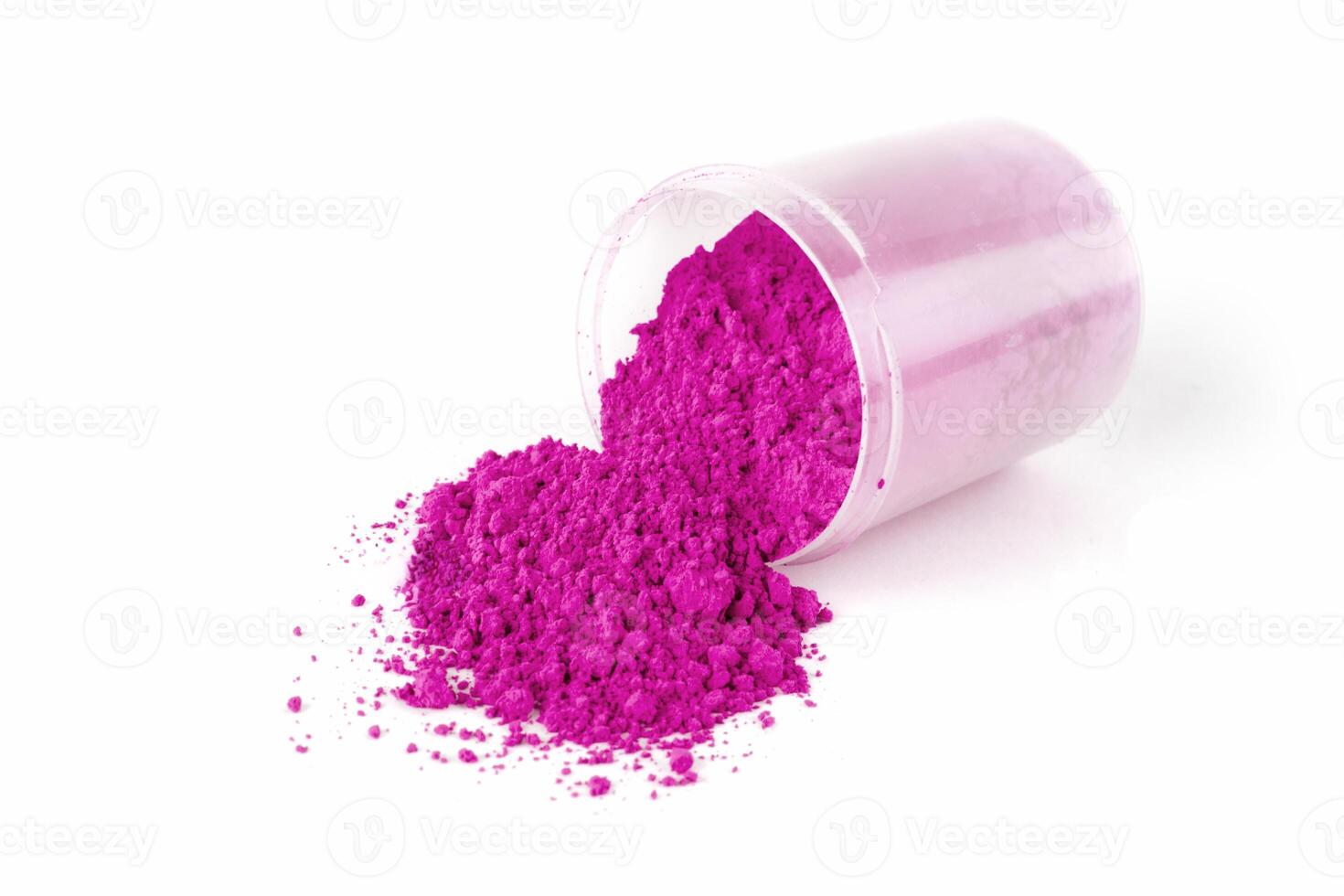 Bright Pink Powder Spills From a Clear Container on to a White Surface in Daylight photo