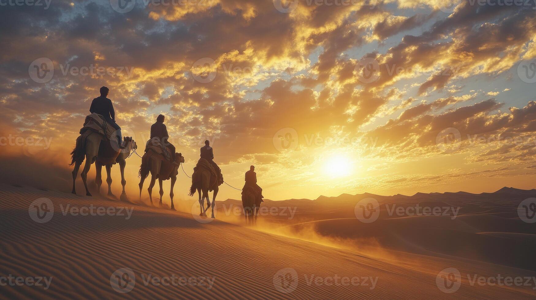 Camel Caravan Silhouetted Against a Sunset Sky in the Desert photo