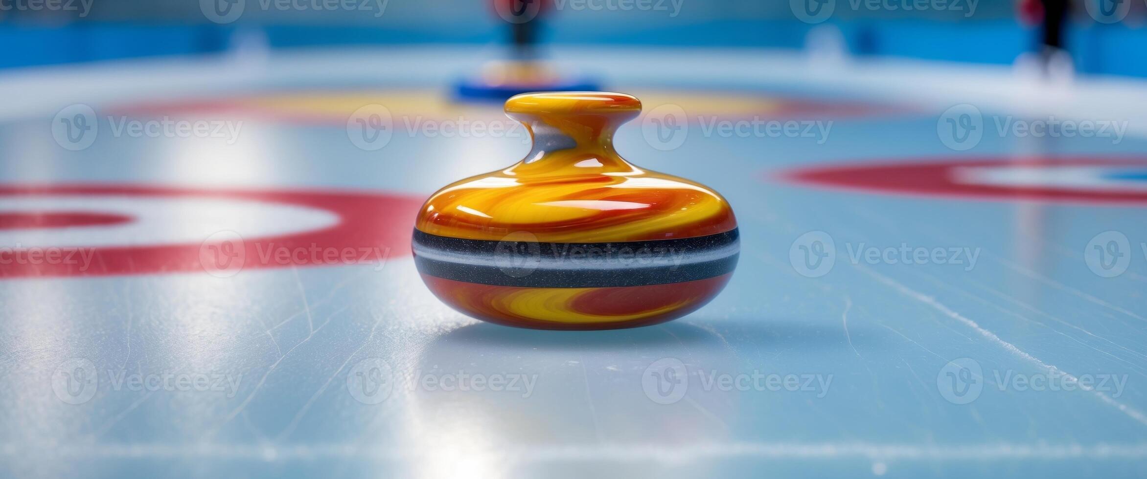 A vibrant curling stone rests on the smooth blue ice of a rink. photo