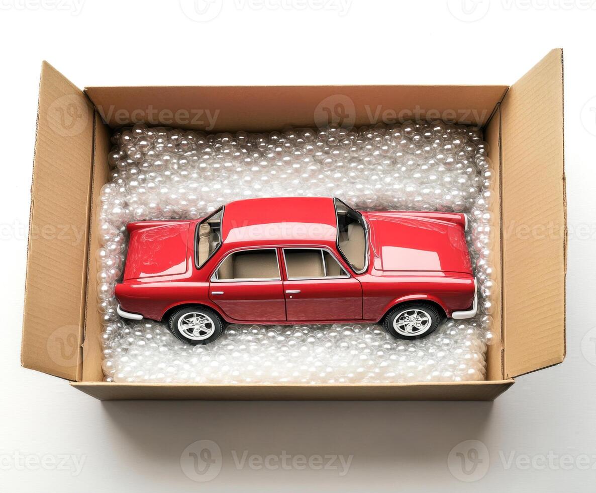 Model car carefully packed in a box filled with protective material for shipping or storage photo
