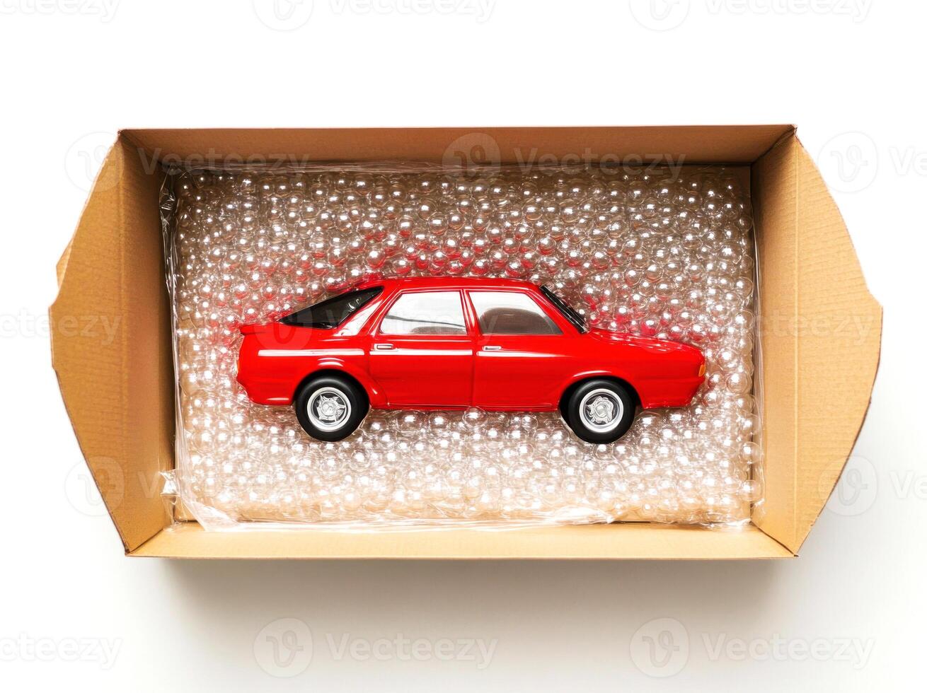 Model car carefully packed in cardboard box with bubble wrap for safe delivery photo