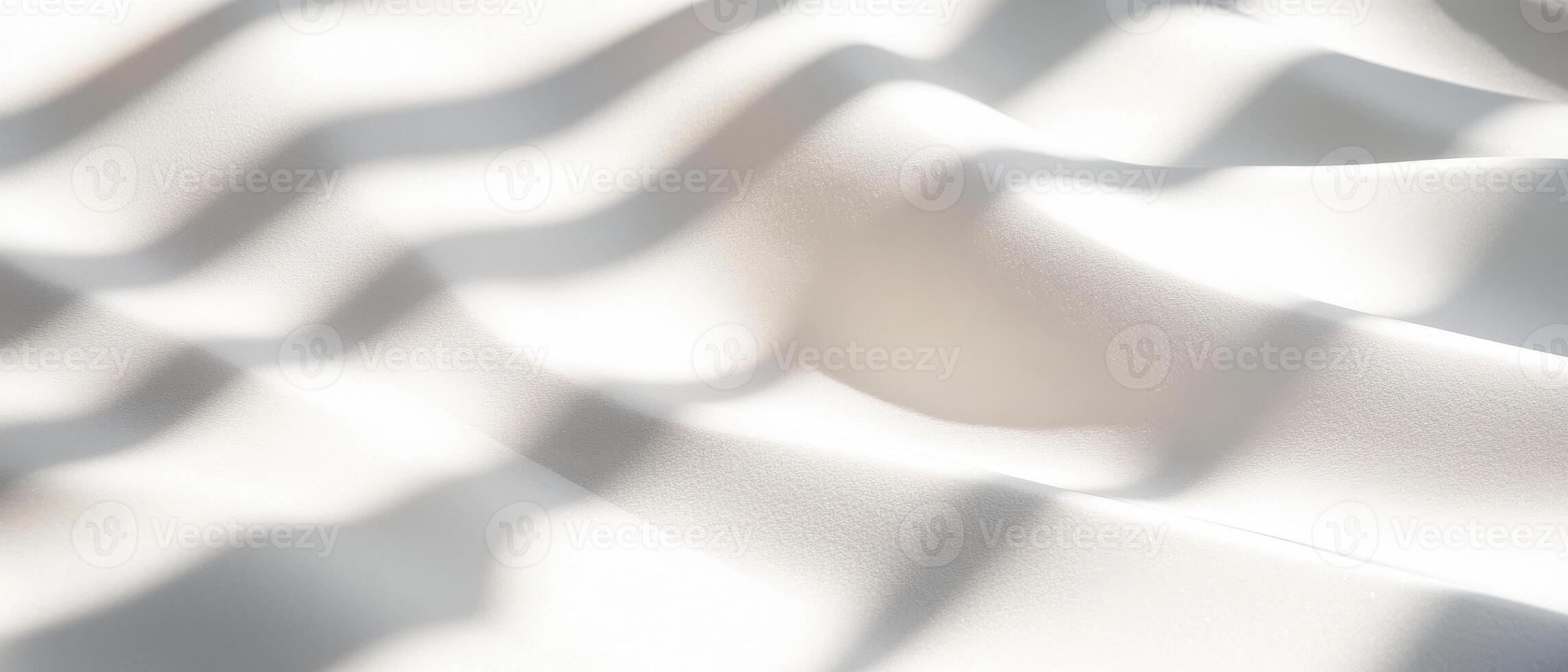 Soft white fabric with layered shadows and highlights creates serene atmosphere. gentle waves and textures evoke sense of calm and elegance photo