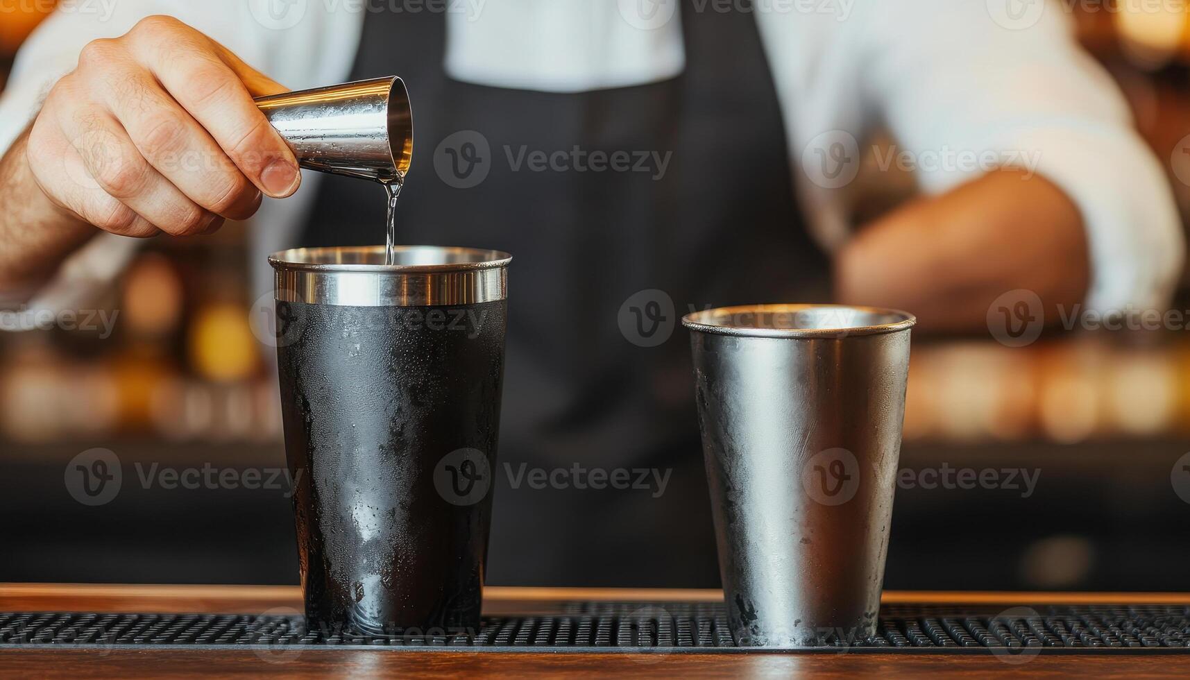Bartender pouring liquid into cocktail shaker, creating refreshing drink. atmosphere is lively and inviting, perfect for enjoying crafted beverages photo