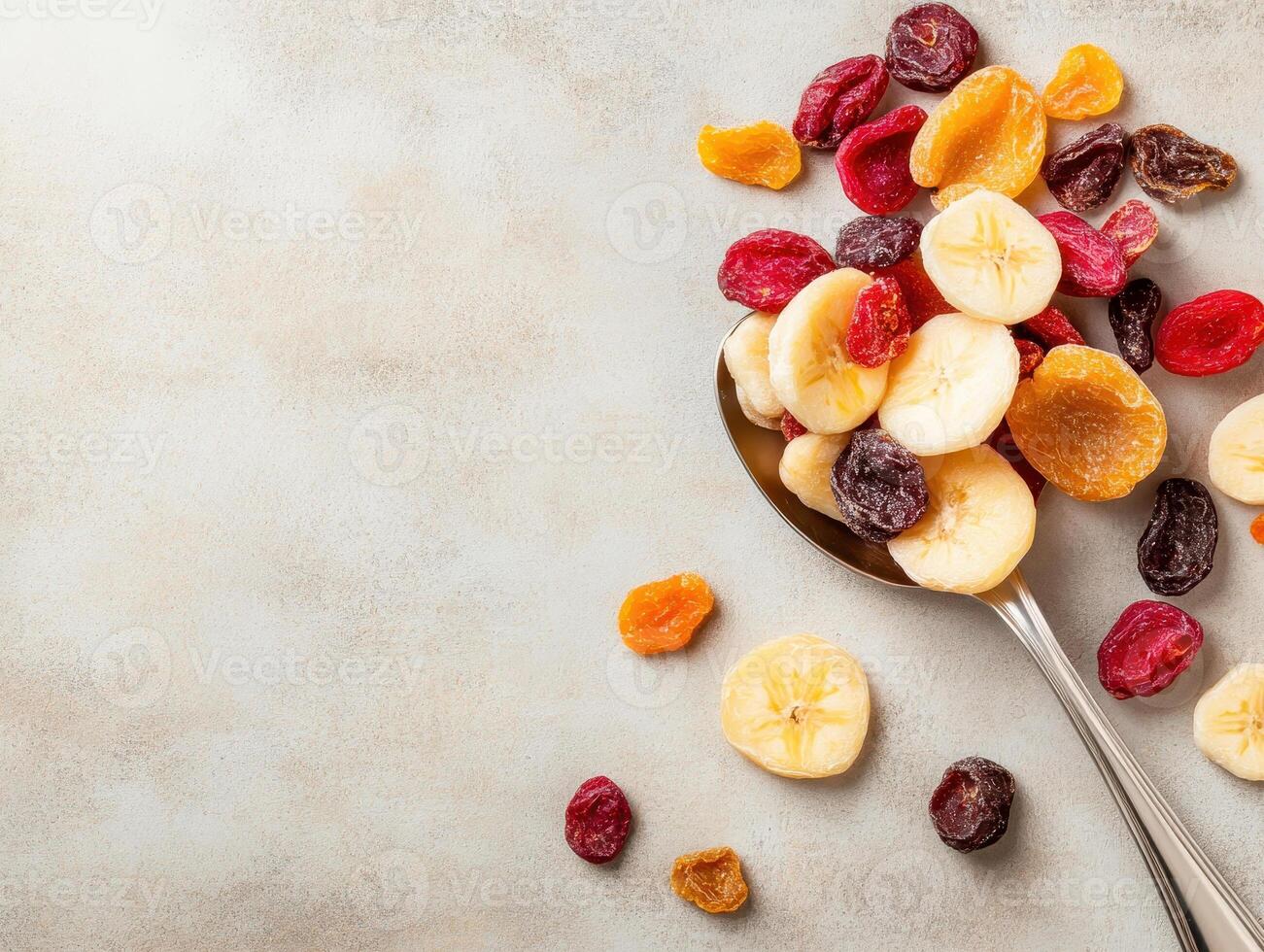 Dried fruits in spoon on rustic background, showcasing vibrant colors and textures. Perfect for healthy snacking or adding to recipes photo
