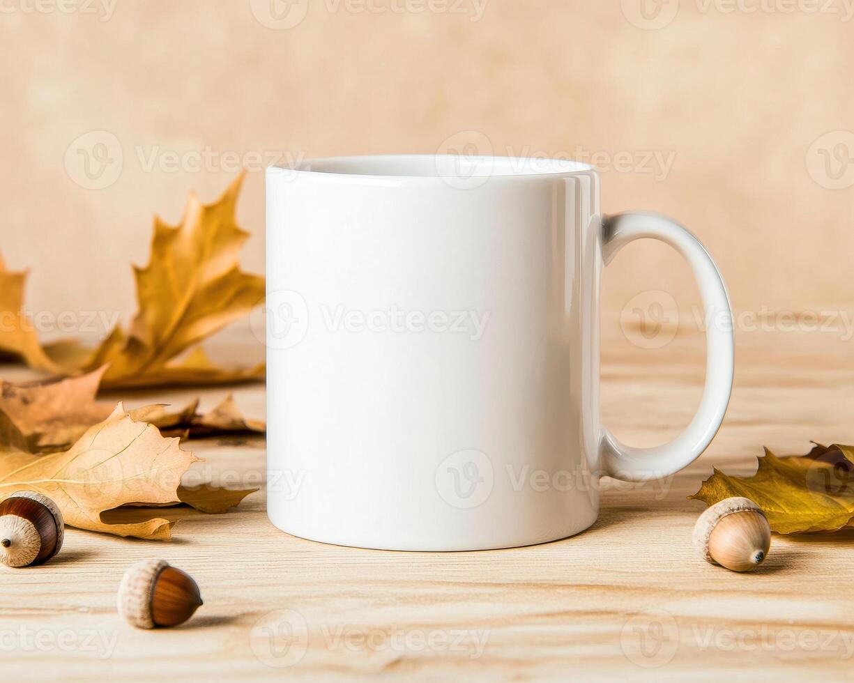 blank white mug surrounded by autumn leaves and acorns, creating warm and cozy atmosphere perfect for fall. Ideal for showcasing seasonal beverages or personalizing photo