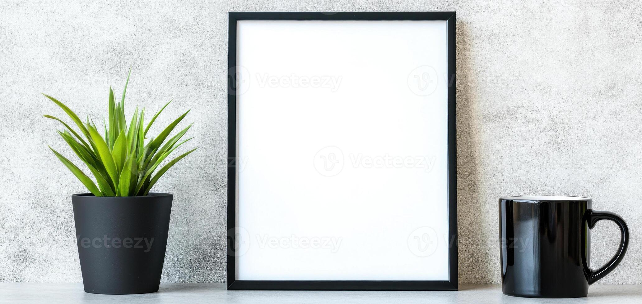 blank frame mockup on neutral toned office wall with plant and cup, creating minimalist and modern workspace atmosphere photo