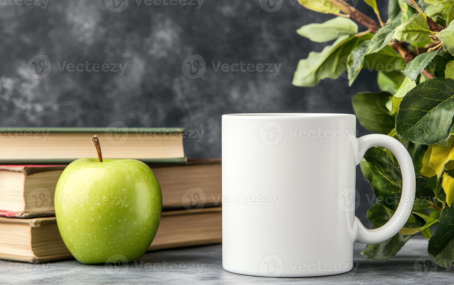 blank white mug sits beside green apple and stacked books, surrounded by leafy greenery, creating serene and inviting atmosphere for study or relaxation photo