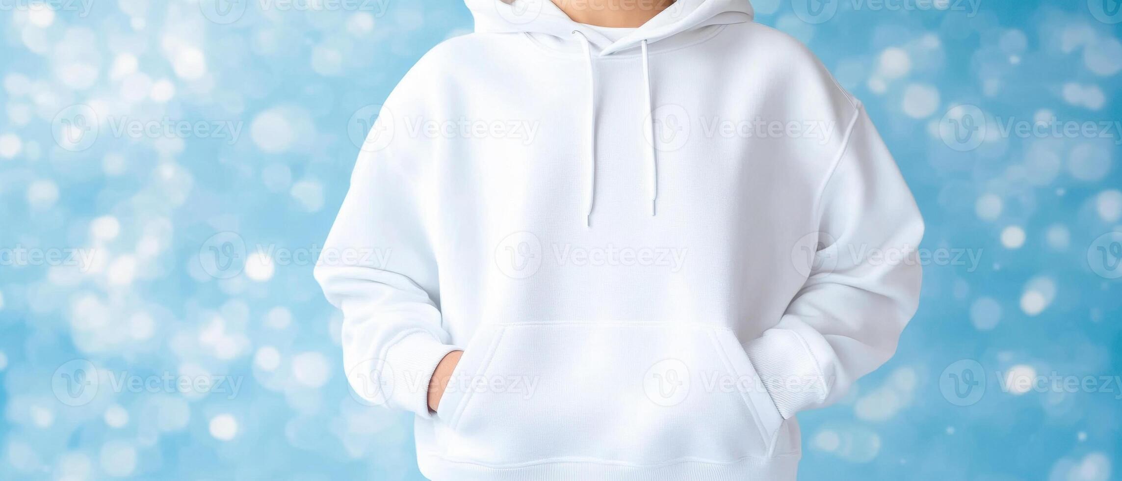 person wearing white hoodie stands against blue bokeh background, exuding casual and relaxed vibe. soft fabric and simple design make it versatile wardrobe choice photo