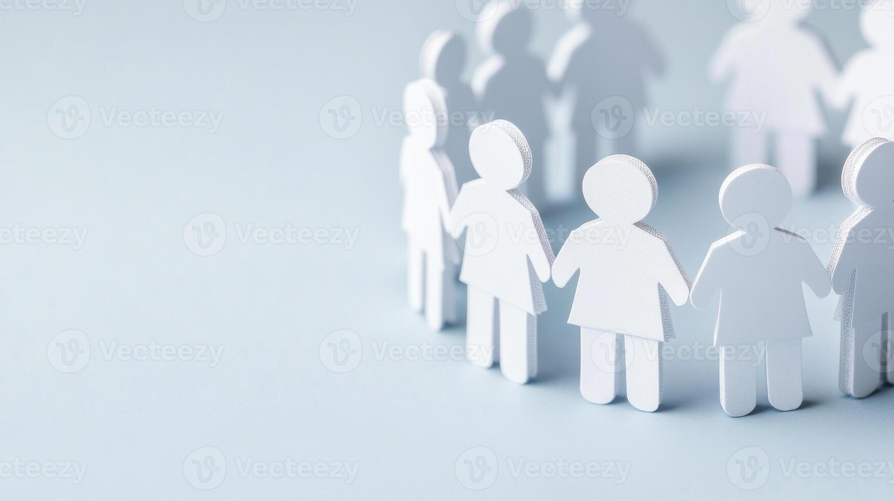 Paper figures representing teamwork and collaboration in circle, symbolizing unity and support. This conveys sense of community and togetherness photo