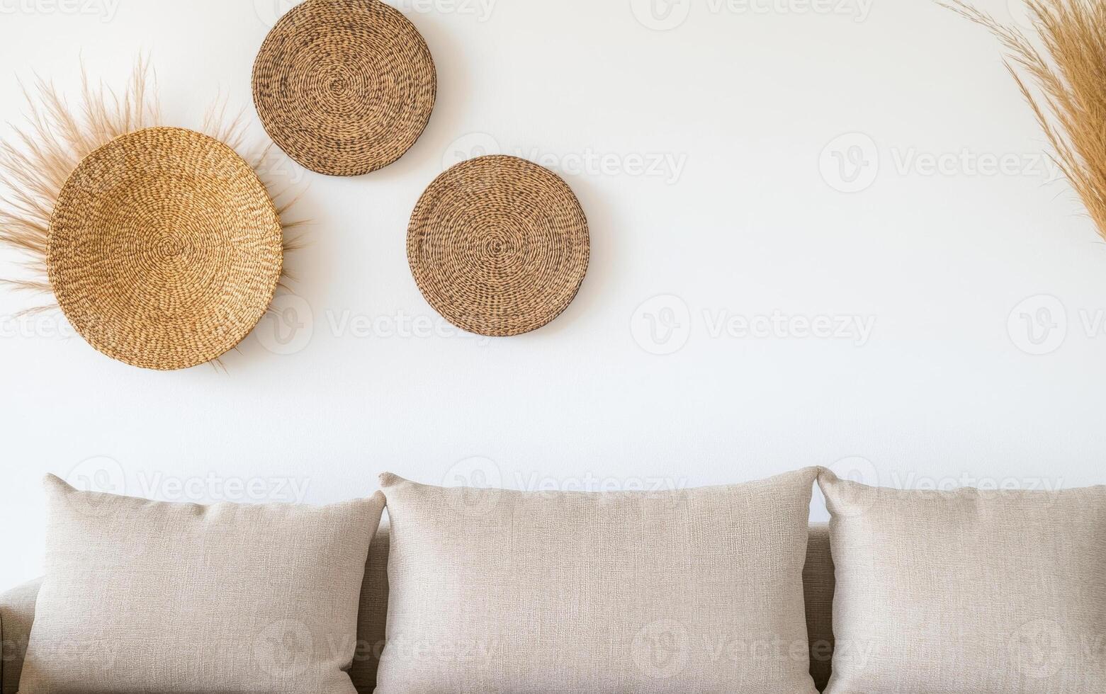 cozy living room featuring neutral sofa adorned with soft cushions, complemented by decorative woven wall art. warm tones create serene atmosphere photo