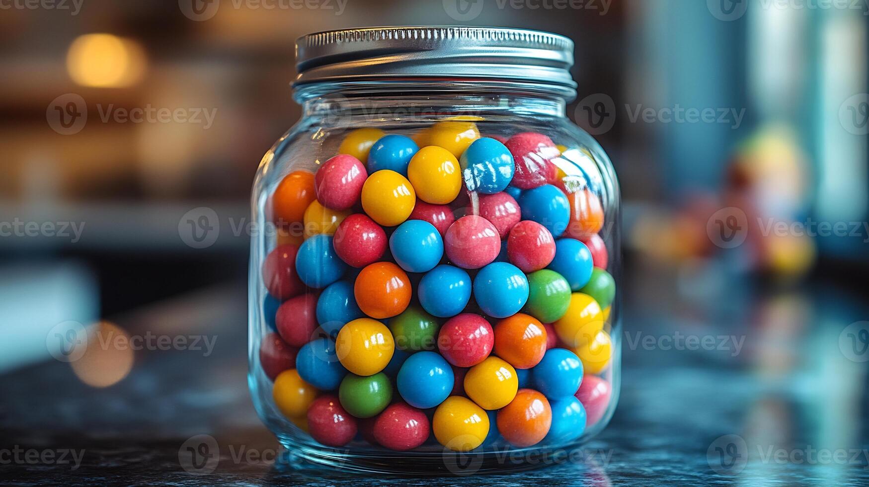 Closeup of vibrant multicolored gumballs arranged neatly a classic glass candy jar with a silver lid photo