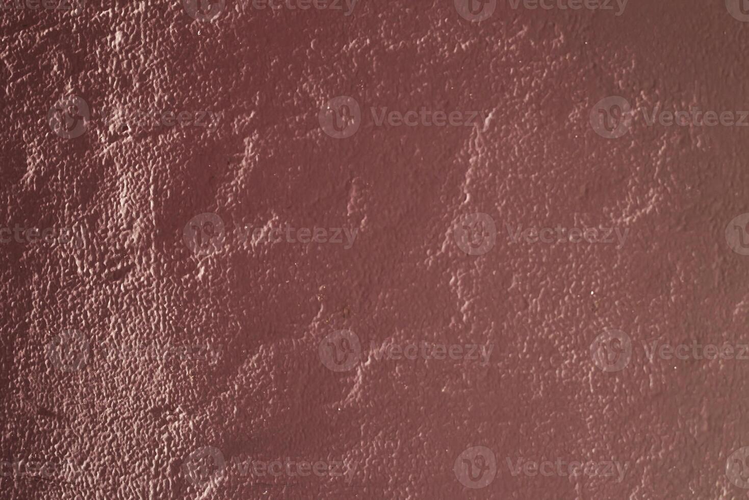 Red textured varnish with light effects and shadows. photo