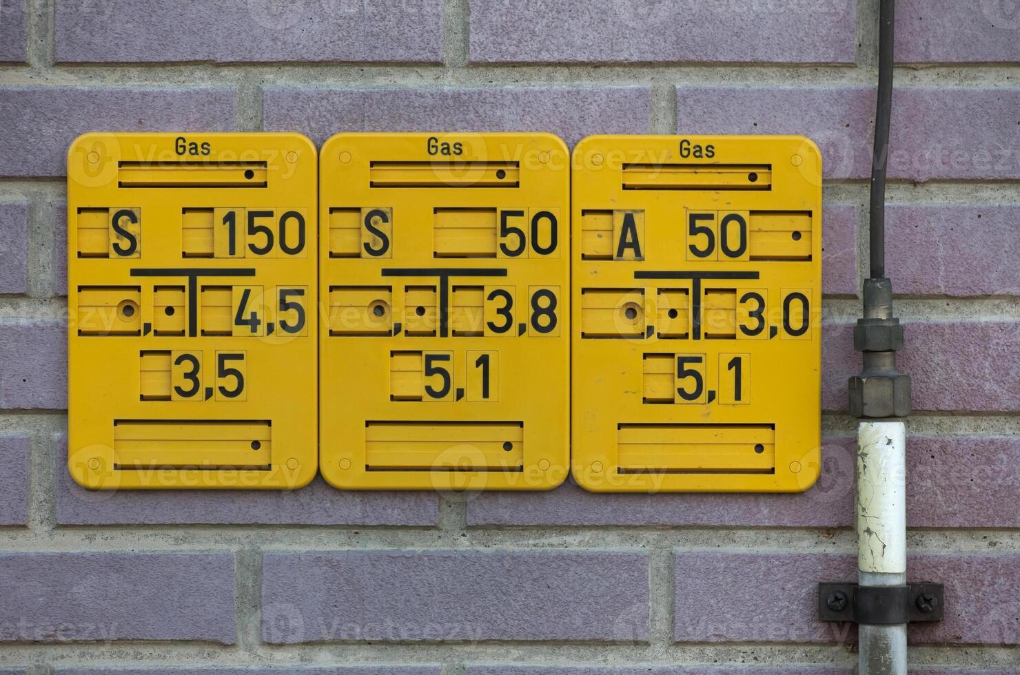 Gate valve sign for natural gas pipes in Germany. The abbreviation on the top left specifies the type of gate valve. The other numbers give size and position of the pipe. photo