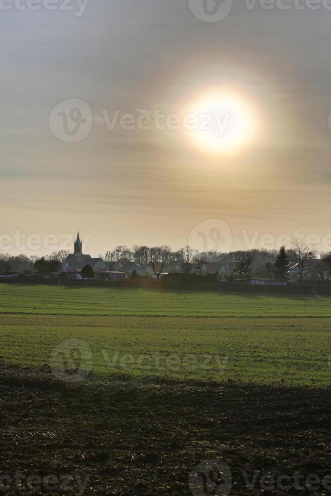 HDR of the blinding winter sun over Magdeburg Ottersleben, Saxony-Anhalt, Germany. photo