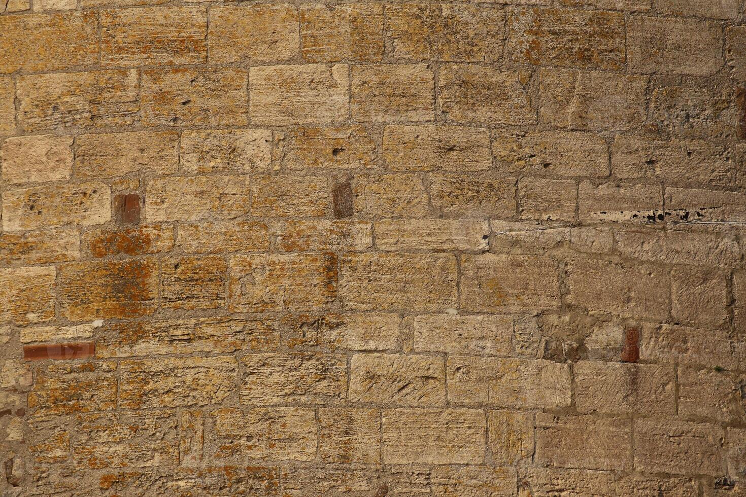 Convex wall made from freestones usable as background or texture photo