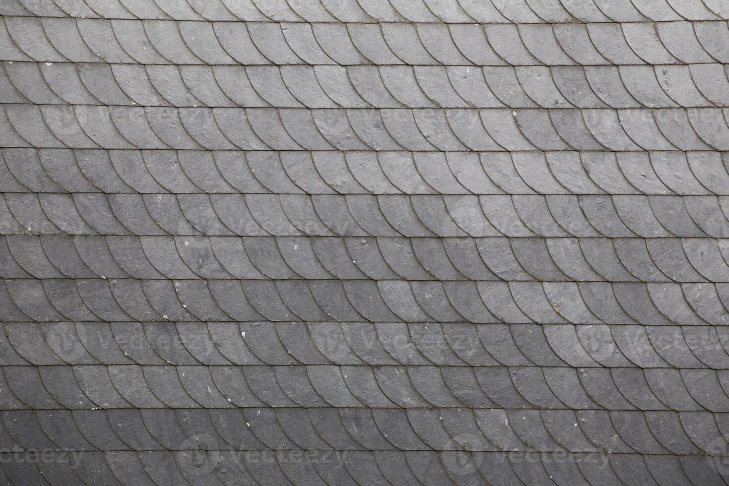 Slate roof tiles with a horizontal arrangement. photo