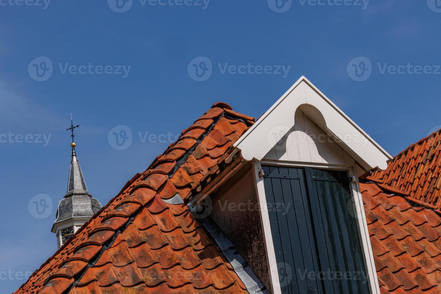 A red roof with white tiles photo