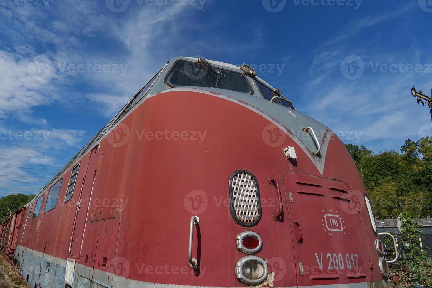 A red train on the tracks in germany photo