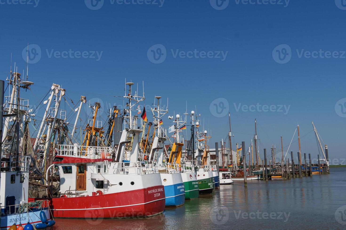 The boats are docked in ditzum photo